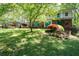 Brick home with a second story balcony and a colorful front yard at 3141 Burnt Hickory Nw Rd, Marietta, GA 30064