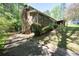 Brick home with mature trees and natural landscaping at 3141 Burnt Hickory Nw Rd, Marietta, GA 30064
