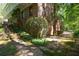 Brick house with multiple stories and a covered balcony accessible by exterior steps, set in a wooded area at 3141 Burnt Hickory Nw Rd, Marietta, GA 30064