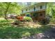 Brick home with a second story balcony and a colorful front yard at 3141 Burnt Hickory Nw Rd, Marietta, GA 30064