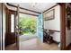 Bright foyer with hardwood floors and a view to the front yard, featuring a uniquely colored entry door at 3141 Burnt Hickory Nw Rd, Marietta, GA 30064