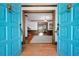 Inviting foyer with decorative blue doors, hardwood floors, and elegant interior details at 3141 Burnt Hickory Nw Rd, Marietta, GA 30064
