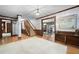 Grand foyer featuring hardwood floors, a staircase, and access to multiple rooms at 3141 Burnt Hickory Nw Rd, Marietta, GA 30064