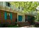 Charming brick home with turquoise shutters and double doors, surrounded by lush greenery at 3141 Burnt Hickory Nw Rd, Marietta, GA 30064