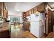 Functional kitchen with wood cabinets, hardwood floors, and natural light from a window overlooking the yard at 3141 Burnt Hickory Nw Rd, Marietta, GA 30064