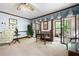 Living room with vintage furnishings, carpeted floors and access to the screened patio and beautiful outdoor views at 3141 Burnt Hickory Nw Rd, Marietta, GA 30064