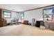 Spacious room with neutral carpet, wood trim, two large windows, and space for storage and seating at 3141 Burnt Hickory Nw Rd, Marietta, GA 30064