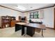 Bright home office space featuring a large window, neutral carpet, wood trim, and ample room for multiple desks at 3141 Burnt Hickory Nw Rd, Marietta, GA 30064