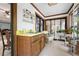 Bright sunroom featuring tile floors, plants, a sink, and sliding glass doors to the outside at 3141 Burnt Hickory Nw Rd, Marietta, GA 30064