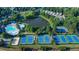 Aerial view of a community featuring a lake, tennis courts, a pool, and a playground at 3870 Cabalzar St, Cumming, GA 30040