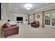 Finished basement featuring a media center, fireplace, and lots of natural light at 3870 Cabalzar St, Cumming, GA 30040