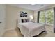Guest bedroom featuring a full-size bed, window, and neutral color scheme at 3870 Cabalzar St, Cumming, GA 30040