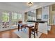 Cozy dining area adjacent to the kitchen and living room, featuring access to the outdoor deck at 3870 Cabalzar St, Cumming, GA 30040