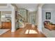 Inviting foyer with hardwood floors, a staircase, and an open floor plan at 3870 Cabalzar St, Cumming, GA 30040