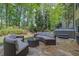 Outdoor patio featuring a hot tub and comfortable seating area with wicker furniture at 3870 Cabalzar St, Cumming, GA 30040