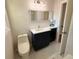 Contemporary bathroom featuring sleek vanity, marble floors, and elegant finishes at 563 Hillandale Circle Sw, Marietta, GA 30064