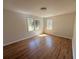 Cozy bedroom with hardwood floors, neutral walls, and natural light from windows at 563 Hillandale Circle Sw, Marietta, GA 30064