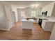 Modern kitchen with white cabinets, stainless steel appliances, and hardwood floors at 563 Hillandale Circle Sw, Marietta, GA 30064