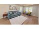 Sun-filled living room with hardwood floors, comfortable seating, and stylish decor at 563 Hillandale Circle Sw, Marietta, GA 30064