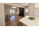 Open-concept living room with hardwood floors, brick fireplace, and abundant natural light at 563 Hillandale Circle Sw, Marietta, GA 30064