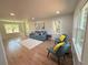 Bright living room with hardwood floors, modern furniture, and multiple windows at 563 Hillandale Circle Sw, Marietta, GA 30064
