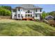 Two-story home boasts a spacious deck perfect for enjoying the outdoors at 648 Gold Valley Pass, Canton, GA 30114