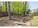 Backyard with bridge over creek leading to the wooden gazebo at 648 Gold Valley Pass, Canton, GA 30114