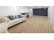 Spacious finished basement with modern decor, couch, and plank flooring at 648 Gold Valley Pass, Canton, GA 30114