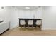 Contemporary basement bar area with seating and stylish black counter at 648 Gold Valley Pass, Canton, GA 30114