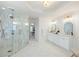 Luxurious bathroom boasting a walk-in shower, dual sinks, and stylish gold fixtures at 648 Gold Valley Pass, Canton, GA 30114