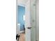 Elegant bathroom showcasing a glass-enclosed shower, white tiling, and a glimpse of the stylish vanity at 648 Gold Valley Pass, Canton, GA 30114