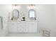 Elegant bathroom with dual sinks, marble countertops, gold fixtures, and bright lighting at 648 Gold Valley Pass, Canton, GA 30114