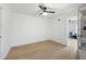 Empty room with wood floor and ceiling fan. Neutral paint and natural light for a blank canvas at 648 Gold Valley Pass, Canton, GA 30114