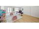 Bright bonus room with light wood flooring and a door to the outside at 648 Gold Valley Pass, Canton, GA 30114
