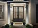 Close-up of a stylish double door entrance with sidelights and modern lighting at 648 Gold Valley Pass, Canton, GA 30114