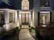 Charming entrance with double doors, sidelights, and stylish exterior lighting at 648 Gold Valley Pass, Canton, GA 30114