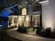 Elegant home with a well-lit walkway and landscaped front yard at 648 Gold Valley Pass, Canton, GA 30114