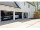 Spacious 3-car garage with vehicles and organized storage solutions at 648 Gold Valley Pass, Canton, GA 30114