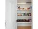 Pantry showcases organized shelving, offering ample storage space for food and household essentials at 648 Gold Valley Pass, Canton, GA 30114