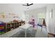 Playroom features carpet floors, natural light, room for a table, bookshelf and play area at 648 Gold Valley Pass, Canton, GA 30114