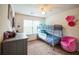 Bright bedroom with bunk beds, chair, and carpet flooring at 7779 Haynes Park Cir, Lithonia, GA 30038