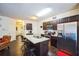 Kitchen area with center island and stainless steel refrigerator at 7779 Haynes Park Cir, Lithonia, GA 30038