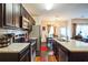 Kitchen with dark cabinets, light countertops, and stainless appliances at 7779 Haynes Park Cir, Lithonia, GA 30038