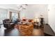 Spacious living room with hardwood floors and neutral paint throughout at 7779 Haynes Park Cir, Lithonia, GA 30038