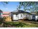Exterior of a cozy home surrounded by a well-maintained yard, featuring gray siding and a small deck at 1515 Jonesboro Rd, Atlanta, GA 30315