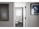 Charming bathroom with tiled floors, a window, and a white toilet at 1515 Jonesboro Rd, Atlanta, GA 30315
