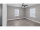 Bedroom with hardwood flooring, ceiling fan, and plenty of natural light at 1515 Jonesboro Rd, Atlanta, GA 30315