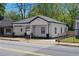 Renovated home featuring a classic design with modern colors, a porch, and landscaping at 1515 Jonesboro Rd, Atlanta, GA 30315