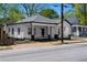 Charming home with a classic design, modern colors, a spacious porch, and landscaped front at 1515 Jonesboro Rd, Atlanta, GA 30315