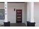 Modern front door with glass inserts, painted columns, and the house number on the column at 1515 Jonesboro Rd, Atlanta, GA 30315
